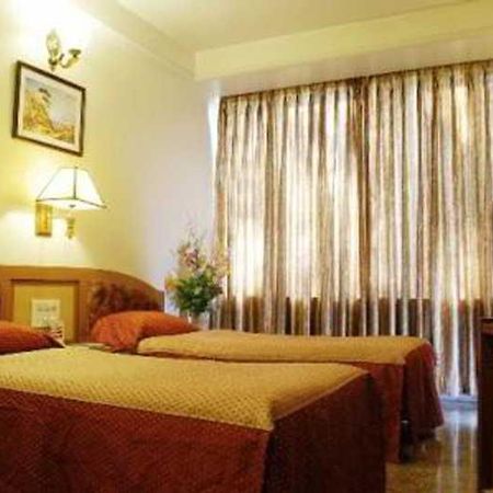Hotel Mandakini Ambience Pune Værelse billede