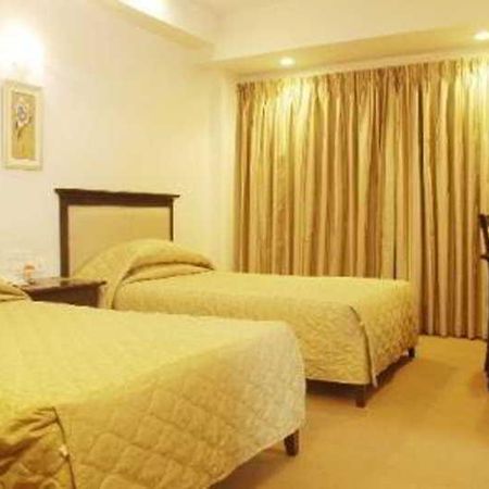Hotel Mandakini Ambience Pune Værelse billede