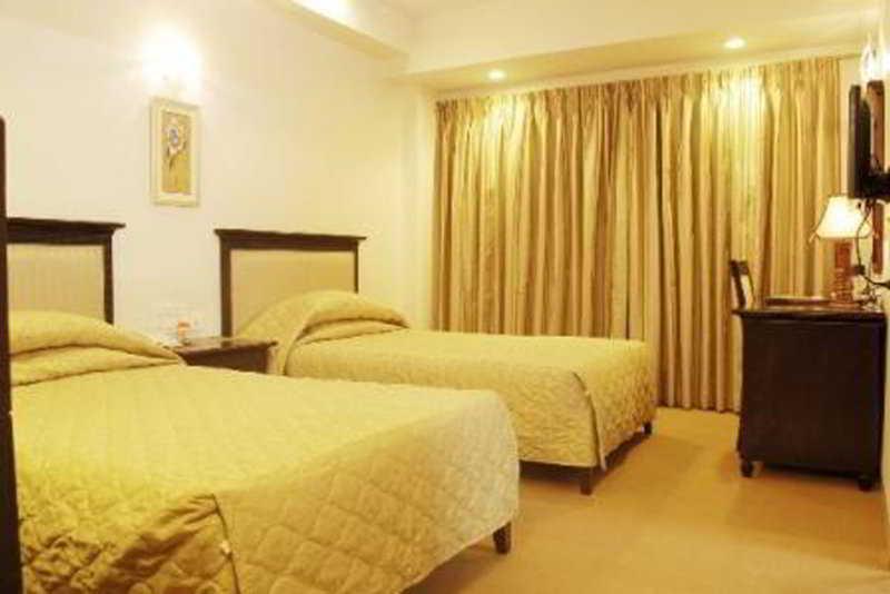 Hotel Mandakini Ambience Pune Værelse billede